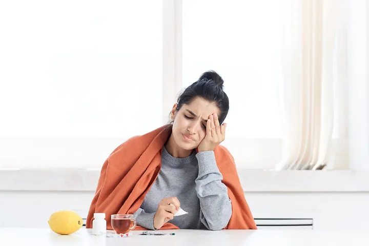 Woman showing iron deficiency mood changes pain
