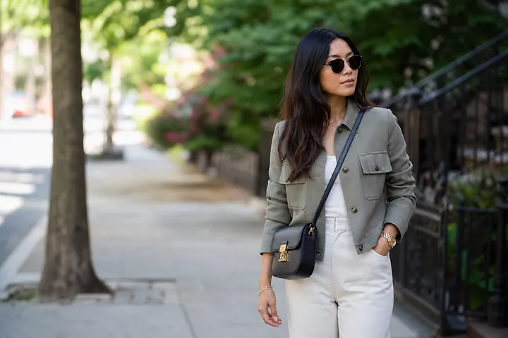 Woman in shoppable street style outfit walking